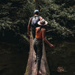 Load image into Gallery viewer, Couple walks across a log over a creek on Hike & Seek day tour from Melbourne