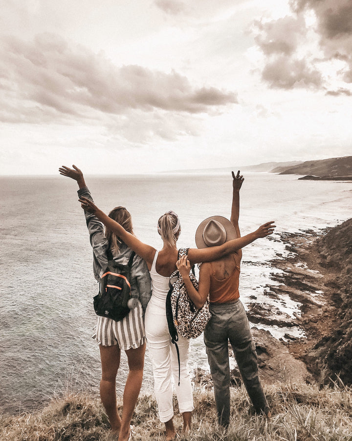 Three girls over looking the ocean on Hike & Seek 12 Apostles, Otways & Great Ocean Road day tour