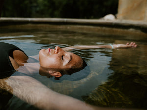 Lady soaks in hot springs on Hike & Seek Mornington Peninsula Day Tour