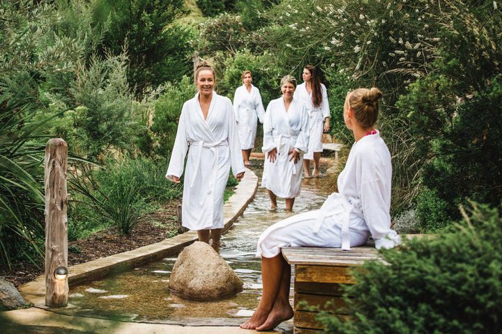 Group of friends enjoy hot springs on Hike & Seek Mornington Peninsula day tour
